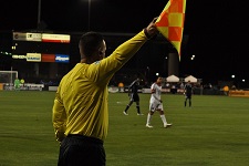 Football referee with flag